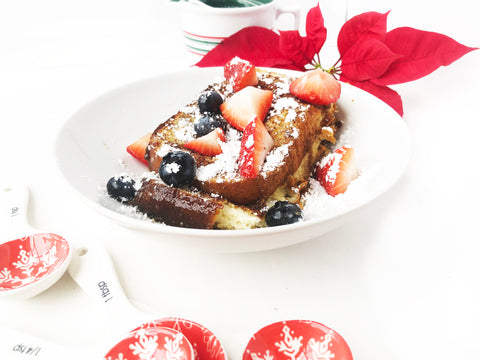french toast casserole plated with berries on top