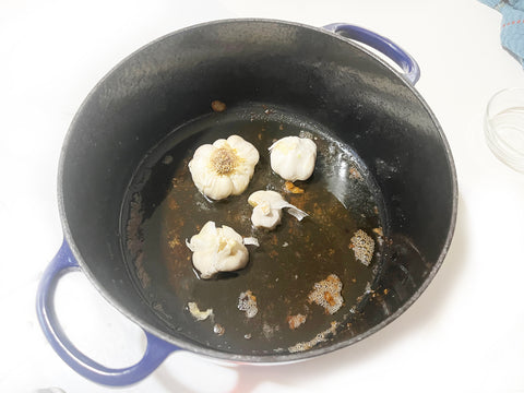 cooking garlic in blue dutch oven