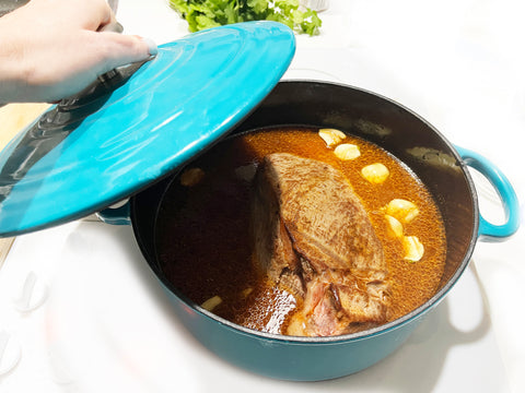 cover meat with lid to slow cook in aqua 5 quart dutch oven