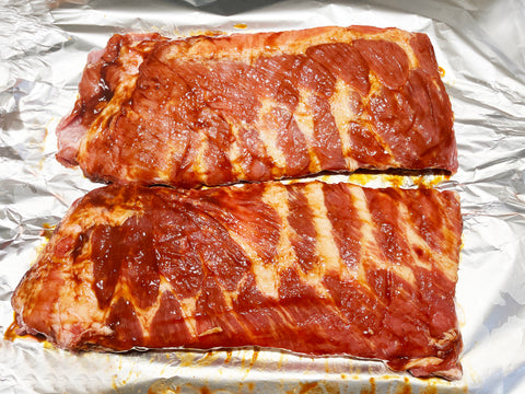 ribs in barbeque sauce before putting into roaster