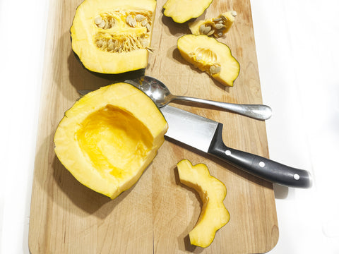 prepping acorn squash before cooking on griddle