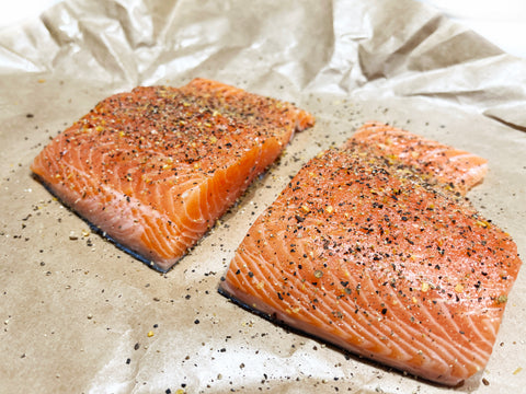 salt and pepper salmon before putting them in id21 steel coated saute pan