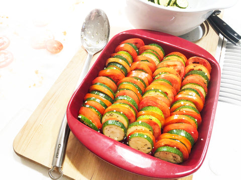 arrange tomato and zucchini slices in square oven dish
