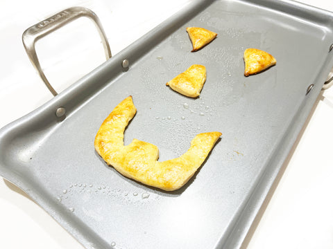 baked face pieces on coated nonstick griddle