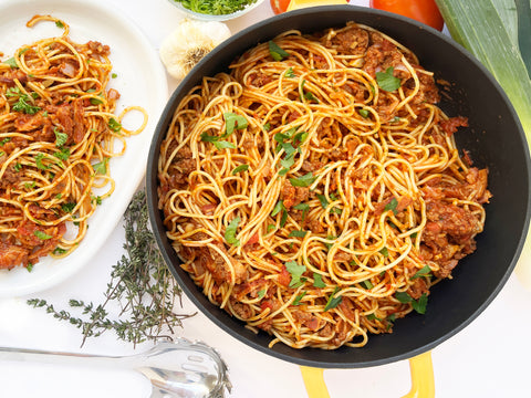 beer beef and bacon spaghetti prepared in cast iron dutch oven and saute skillet marigold