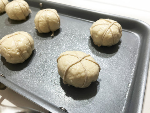 pumpkin biscuits tied with string on stainless steel coated nonstick griddle