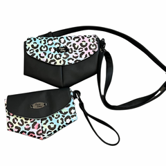image on a white background shows a pair of envelope style bags with black vinyl and pastel rainbow leopard print. Smaller bag is a clutch wristlet and larger bag has a longer crossbody strap