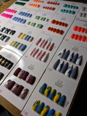 Image shows several sets of press on nails in different colours