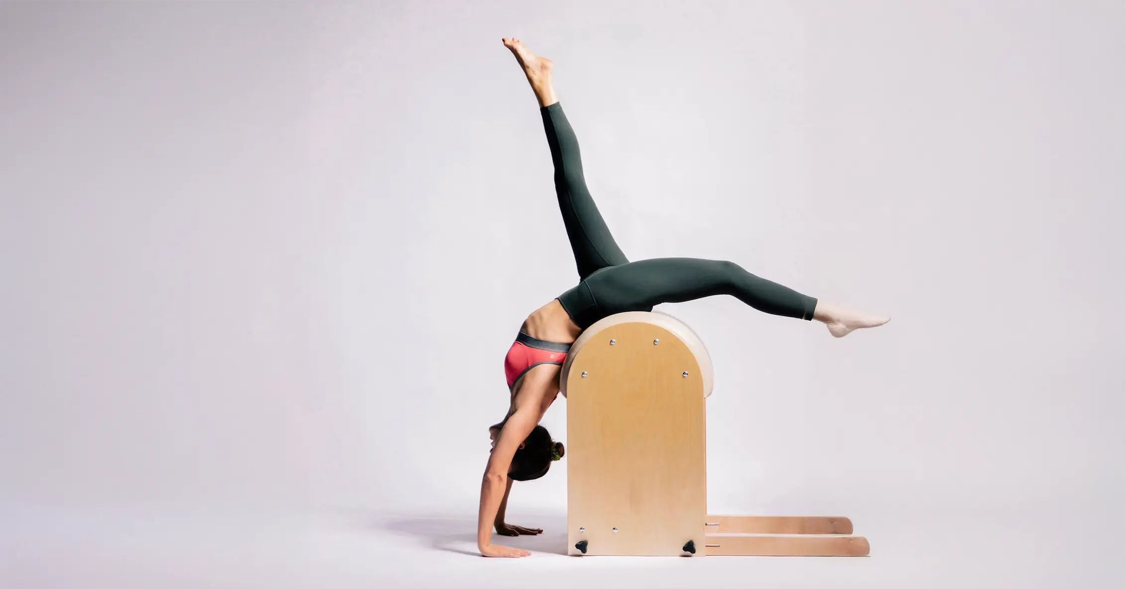 Alli Bowers from Heights Pilates on the Ladder Barrel