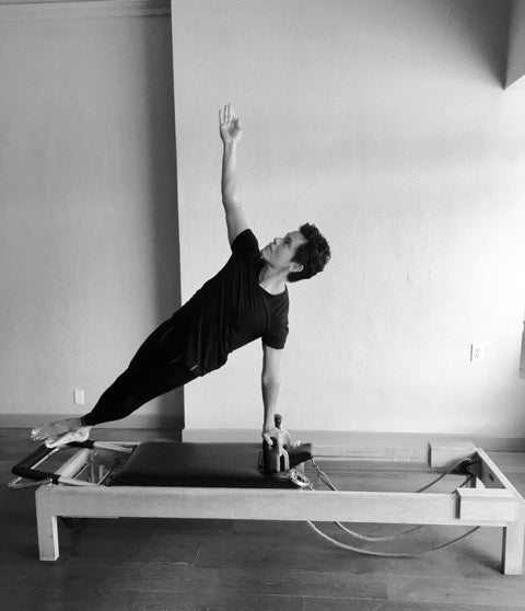 Gratz Gallery | Saul Choza performing the One Arm Twist on the Universal Reformer