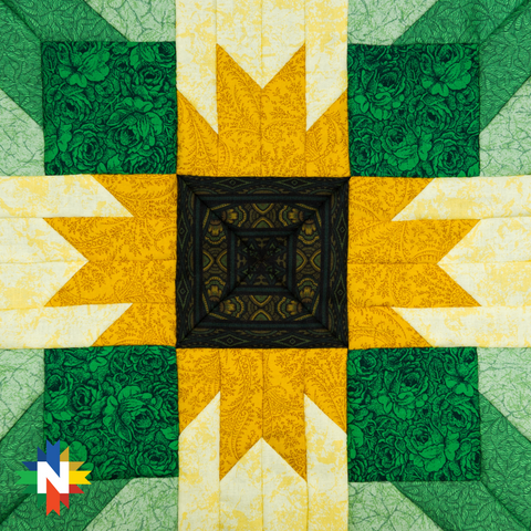 Picture of a star quilt block in green and yellow