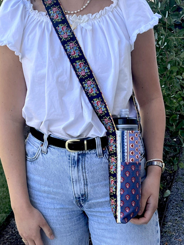 Woman wearing a handmade bag to hold a water bottle