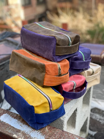 Six dopp kits in varying colors