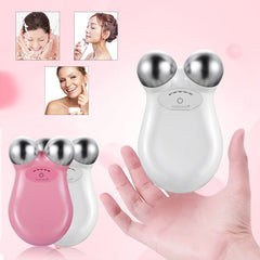 Mini Facial Toning Device, White and Pink, held in Hand