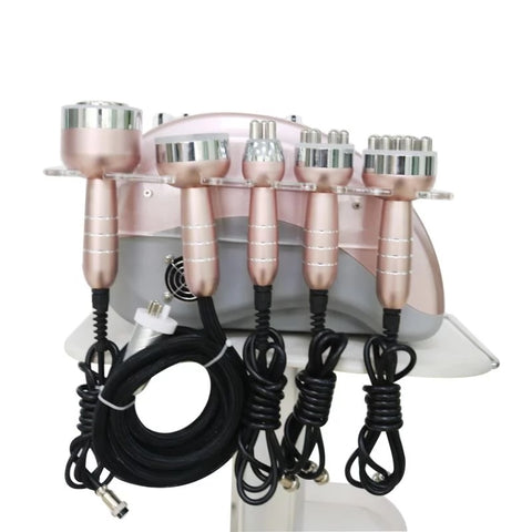 Side view of rose gold color 6 in 1 Lipo Cavitation Machine featuring Probe Handles