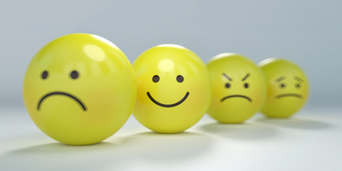 Yellow spheres with various facial expressions 