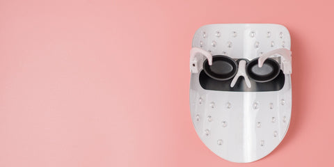 LED Light Therapy Mask, inside surface, pink background 