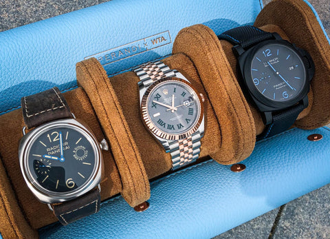 Watches stored in a leather watch roll