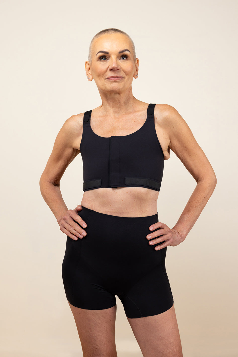 Understance Soft Contour Post-Op Compression Bra @Tina wears Black in Small - Underbust: 30", Leaning Bust: 31.5", Standing Bust: 31.5" #color_black