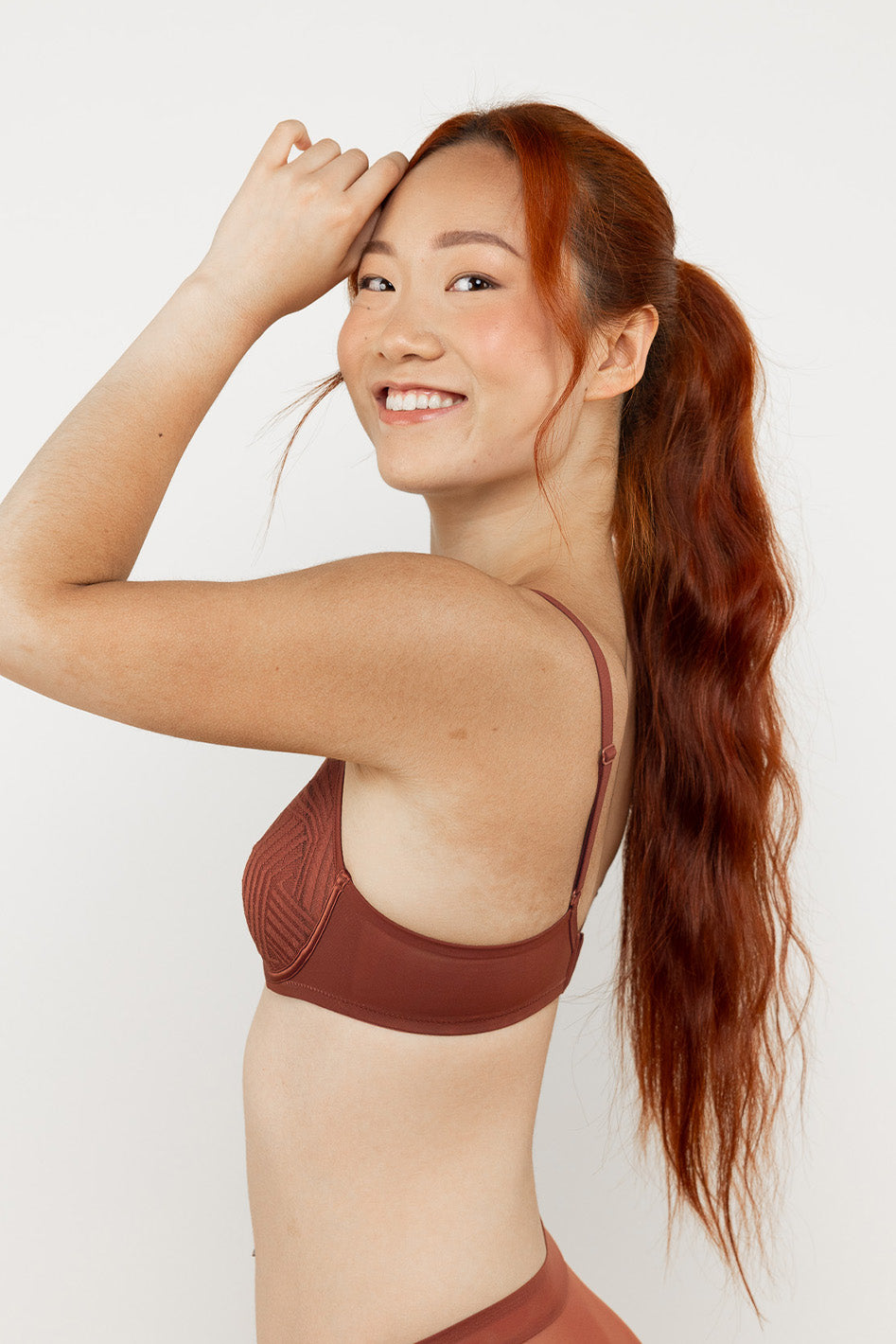 Understance Aubrey UniWire Lightly Padded Demi Bra @Melody wears Terra Cotta in 32A - Underbust: 30.5", Leaning Bust: 34.5", Standing Bust: 33.5" #color_terra-cotta