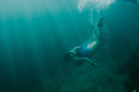 Mermaid swimming in a sea pool in Cornwall