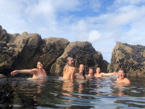 Group of Wild Swimmers naked in a Secret Swim Spot of a Sea Pool in Cornwall UK