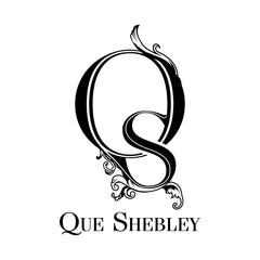 Que shebley logo