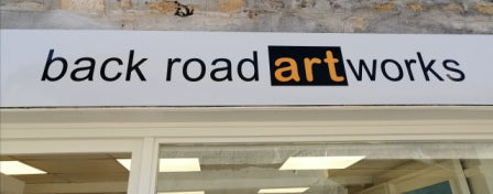 Image of Back Road Artworks sign above the door