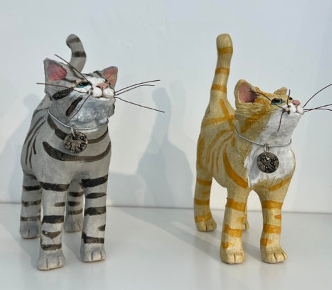 Ceramic cat figures by Emily Stracey