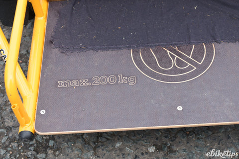 Cargo bike platform with 200kg weight limit written on surface