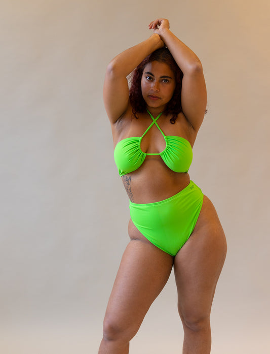 green halterneck bikini on model