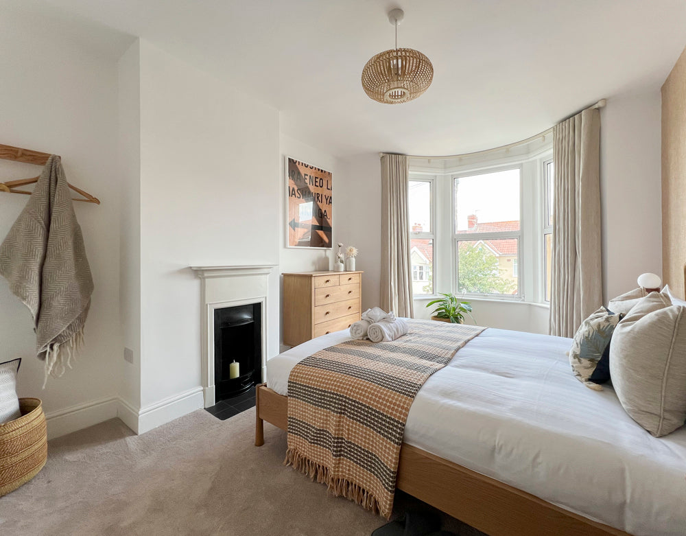 Bay window bedroom featuring a fireplace, South Bristol whole house detail