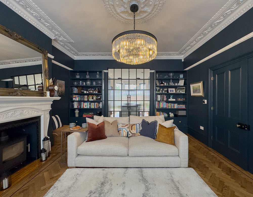 Period living room showcasing ornate cornicing, wood burner fireplace, and elegant formal seating arrangement | Ivywell Interiors l Bristol