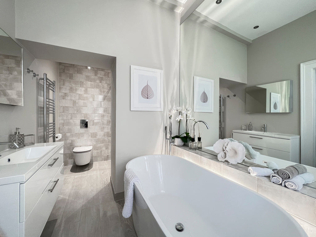 Bathroom with freestanding bath in a neutral and luxurious colour scheme