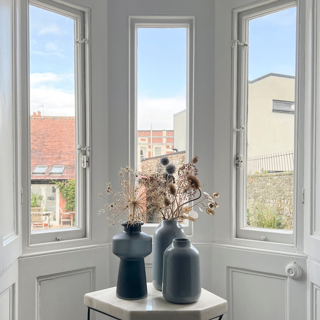 Side Table with collection of vases