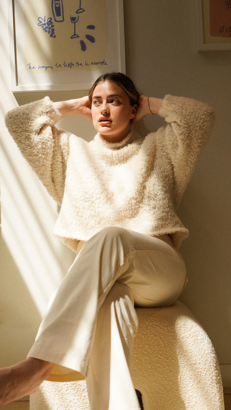 Ali Whittle wears the Dawn Knit in Ivory with the Anya Pant in Ivory