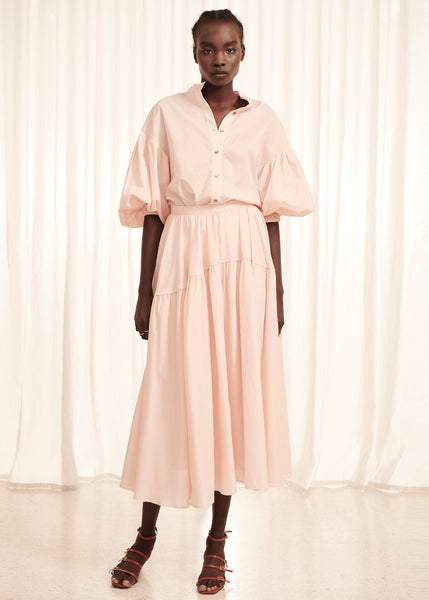 Nylow wears the Parker Shirt and Skirt in Pink.