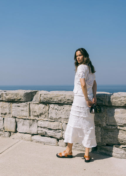 Ally wears the Anais Crochet Shirt with the Eloise Skirt (part of set).