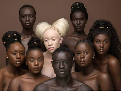 A collection of male and females with different shades of black skin tones