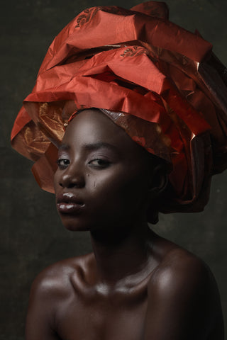 Black female with head wrap showaching the tignon law 