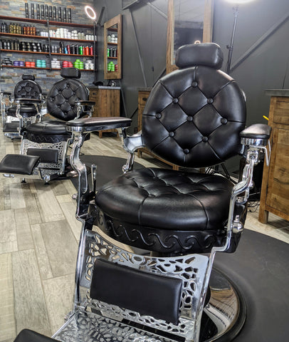 black barber chair in salon