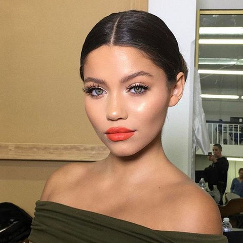 Orange lipstick with green dress