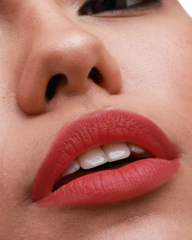 Coral lipstick with green dress