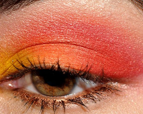 combination of reds and burnt oranges eyeshadow