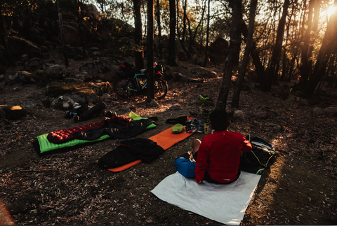 sleeping bags and Bikepacking essentials in the woods