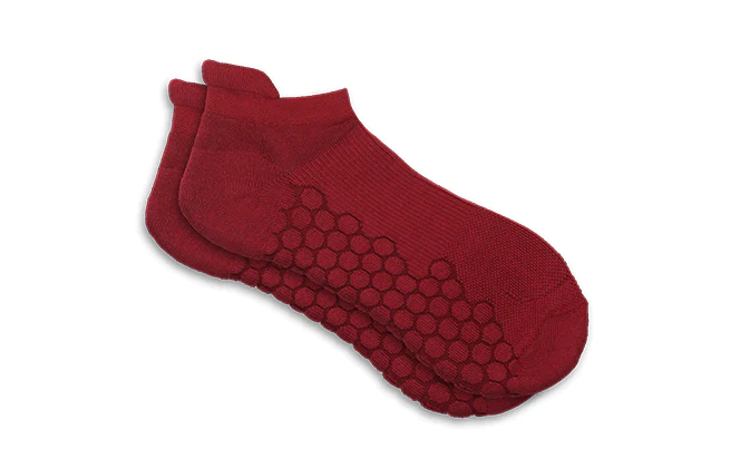 red pair of ankle socks by neverquit socks brand