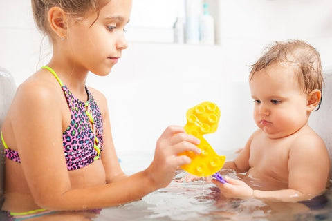 Children playing in the bath