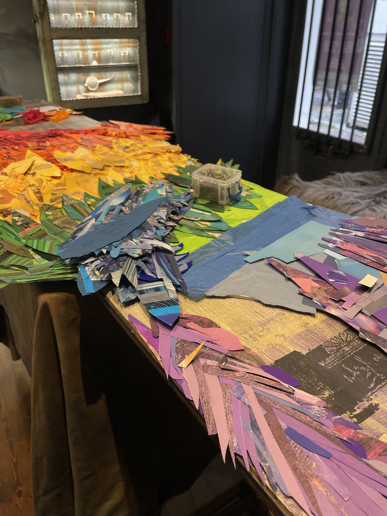 Attaching rainbow feathers to angel wings