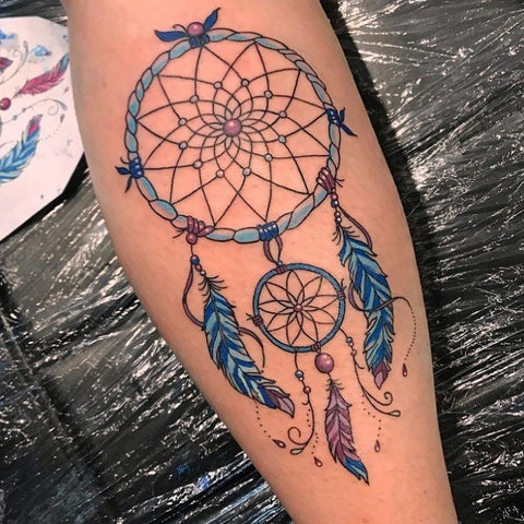Tatouage Attrape-rêve Mandala bleu avec perle et deux cercles 