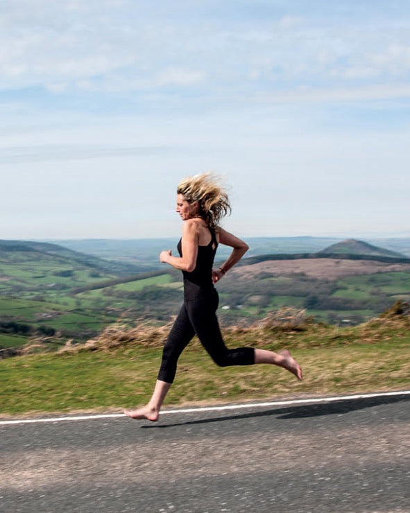 Lynne Allbutt running barefoot across Wales